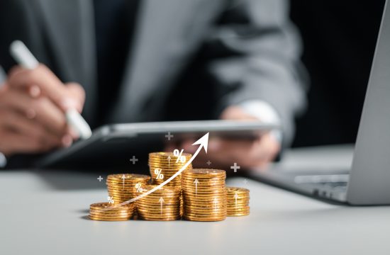 Businessman collecting coins with profit chart analysis business growth, profit growth management and corporate financial statistics. finance and investment concept.